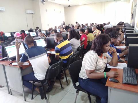 Students seated at computers during a supervised CBT examination